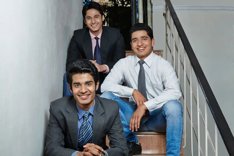 Three Roommates sitting on Staircase